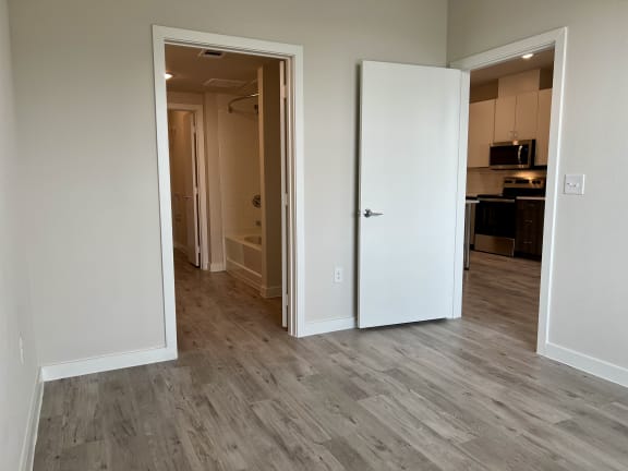 Empty room with doorways to bathroom and kitchen at Bridge at Windsor Park Apartments, Texas, 78723