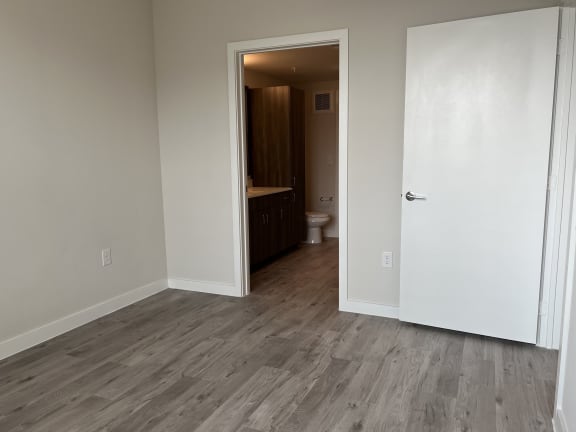 Empty room with view into bathroom at Bridge at Windsor Park Apartments, Austin, TX 78723