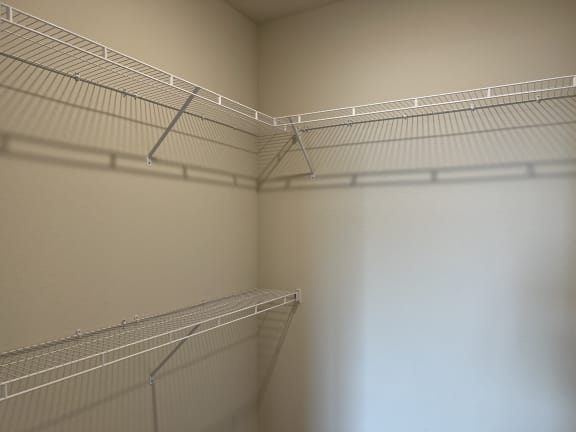 Walk-in closet with wire shelving on multiple walls at Bridge at Windsor Park Apartments, Austin, Texas