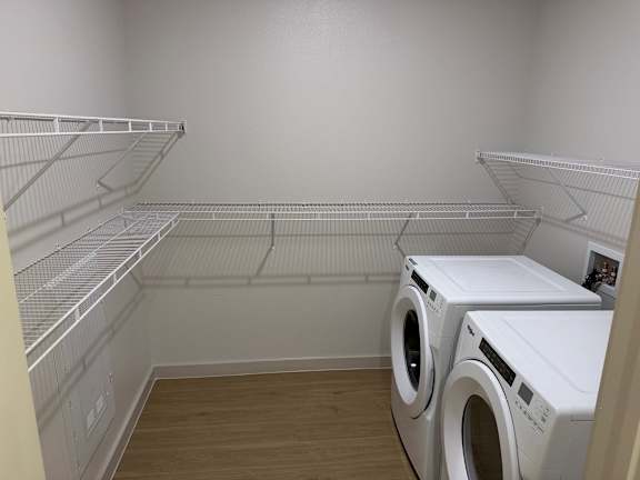 A laundry room with a washer and dryer.