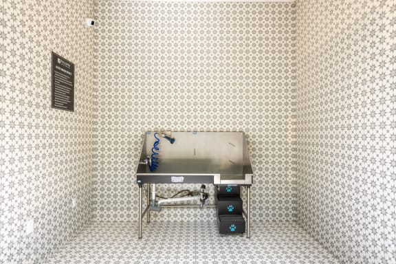 a stainless steel barbecue in the corner of a room