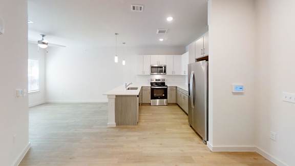 A kitchen with a refrigerator, oven, and microwave. at Park South Apartments, Austin, 78748