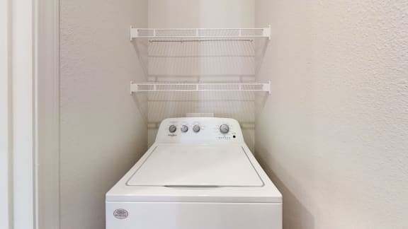 a laundry room with a washer and dryer  at Avery Ranch, Texas, 78717