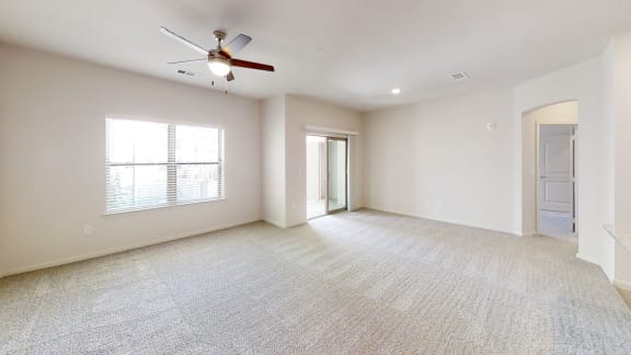 an empty living room with a ceiling fan and a window at Avery Ranch, Texas, 78717