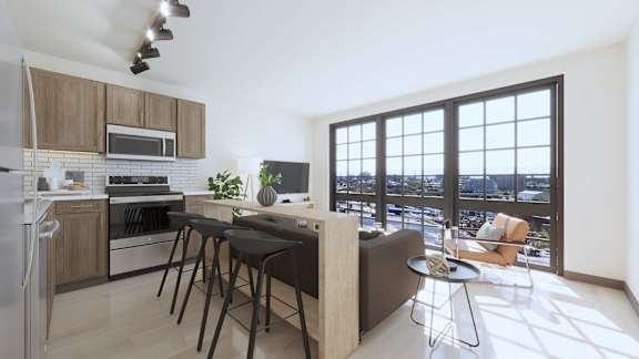 A modern kitchen with a large window overlooking the city.