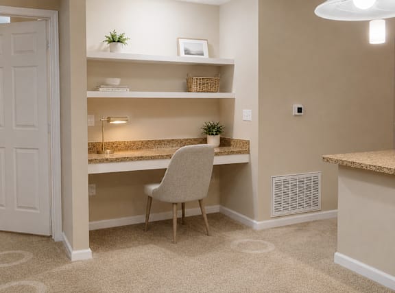 A room with a desk and a chair.