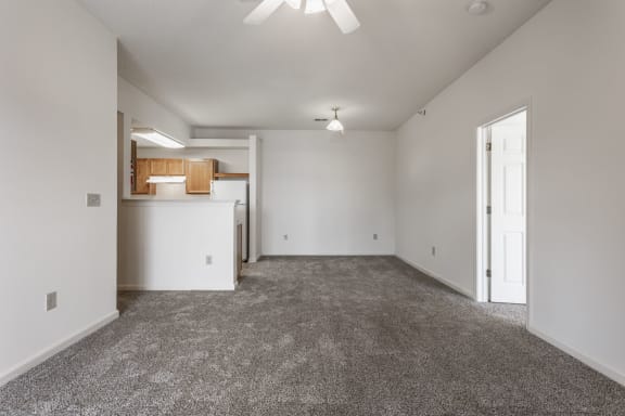 living room and kitchen with white walls and carpet at Polo Run Apartments, Indiana, 46142