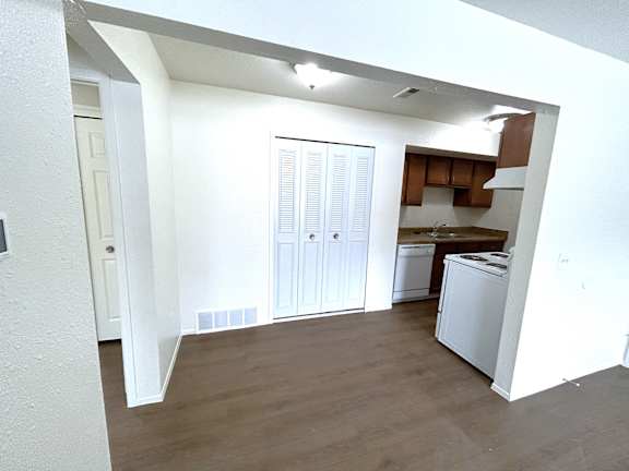 A dining room with white walls.