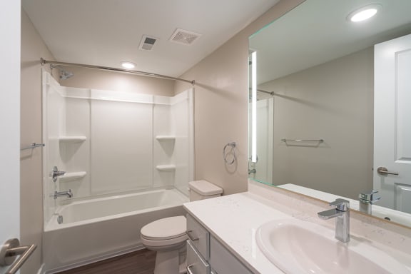 a bathroom with a bathtub and a sink at Hillside Apartments, Michigan