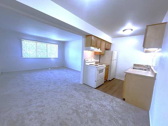 Open basement suite with kitchen and living area at Charter Oaks Apartments, Davison, Michigan