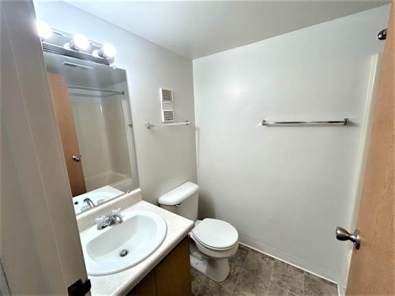 Bathroom with vanity sink and toilet towel bar at Charter Oaks Apartments, Davison, 48423