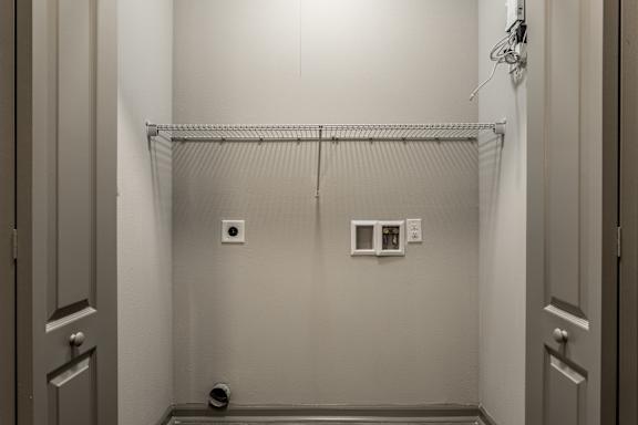 a white room with a shower in it and a white door at Bella Vista Apartments, Indiana, 46038
