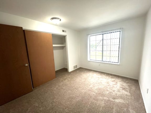 Bedroom with built in closet and recessed nook at Charter Oaks Apartments, Davison, 48423