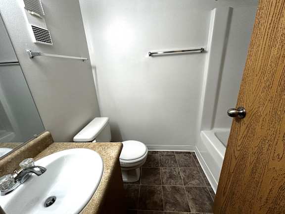 Bathroom with walk in shower and towel bar at Charter Oaks Apartments, Davison, MI