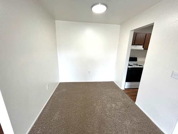 A carpeted dining room