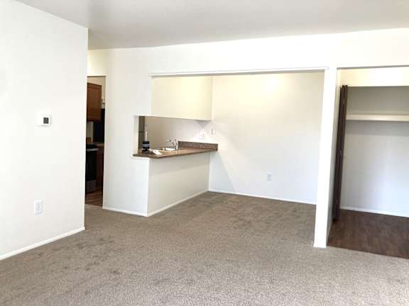 A dining room with a breakfast bar.