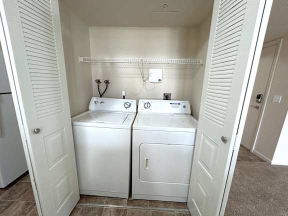 In unit washer and dryer in closet alcove at Heatherwood Apartments, Michigan, 48439