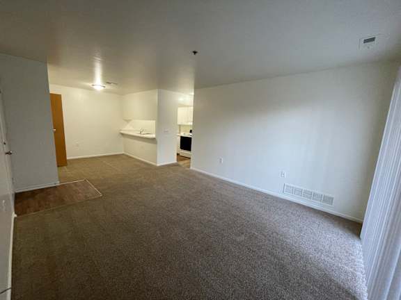The living room with dining room and breakfast bar.