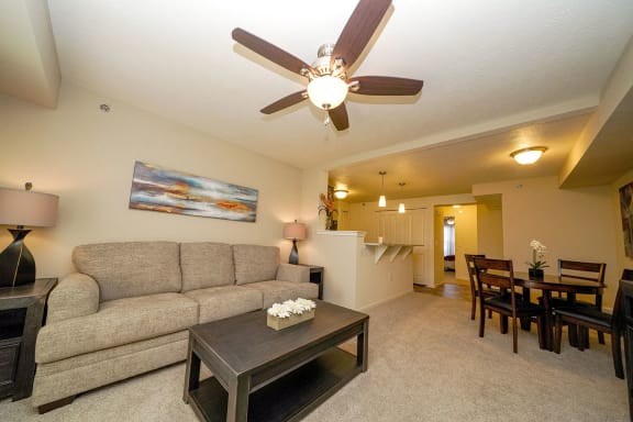 a living room with a couch and a coffee table  at Andover Pointe Apartment Homes, La Vista