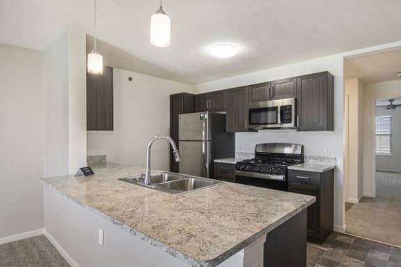 Kitchen with built-in microwave at Andover Pointe Apartment Homes in LaVista, NE