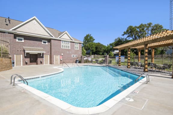 Swimming Pool with Pergola Outdoor Pool Area at Andover Pointe Apartment Homes in Nebraska