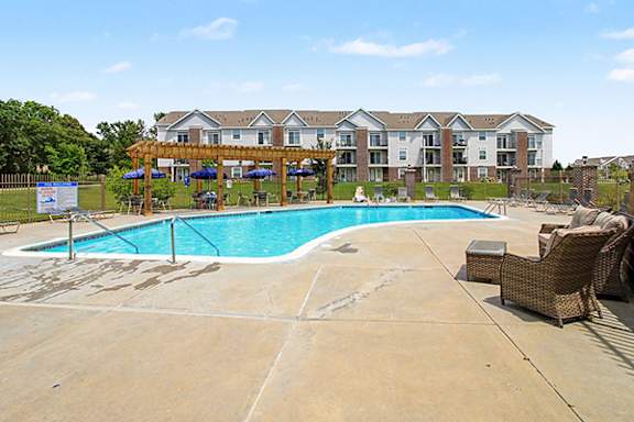 Swimming Pool with Pergola Outdoor Pool Area at Andover Pointe Apartment Homes in Nebraska