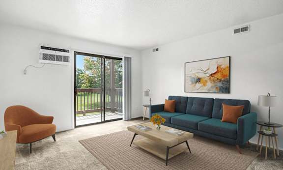 A living room with a slider to a private balcony at Apple Ridge Apartments, Walker, MI