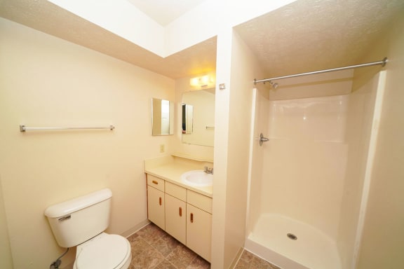a bathroom with a sink toilet and a shower at Autumn Lakes Apartments and Townhomes, Mishawaka, IN