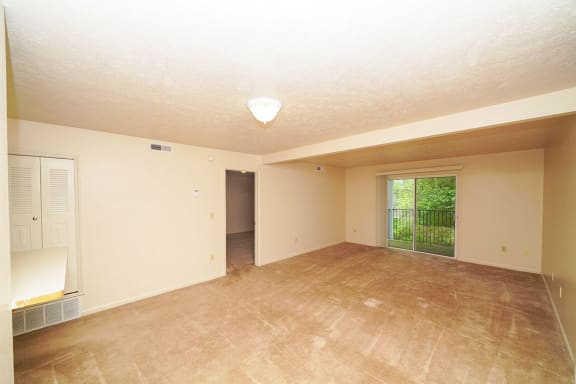 the living room and dining room of an empty house at Autumn Lakes Apartments and Townhomes, Indiana, 46544