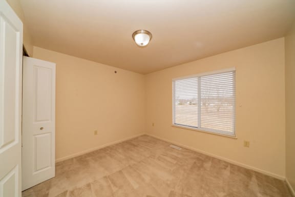 an empty room with a window and a door at Autumn Lakes Apartments and Townhomes, Mishawaka, IN, 46544