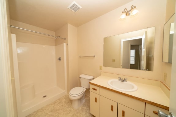 a bathroom with a sink toilet and a shower at Autumn Lakes Apartments and Townhomes, Mishawaka, IN