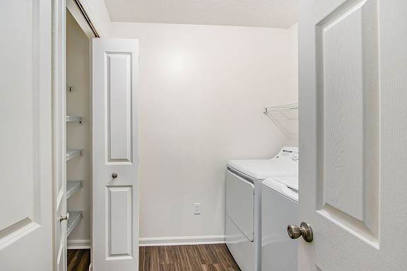 A laundry room with a washer and dryer and a closet at Autumn Lakes Apartments and Townhomes, Mishawaka, 46544