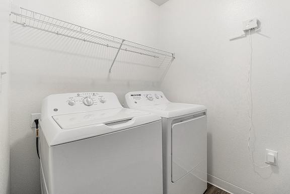 A laundry room with a full-size washer and dryer at Autumn Lakes Apartments and Townhomes, Mishawaka, 46544