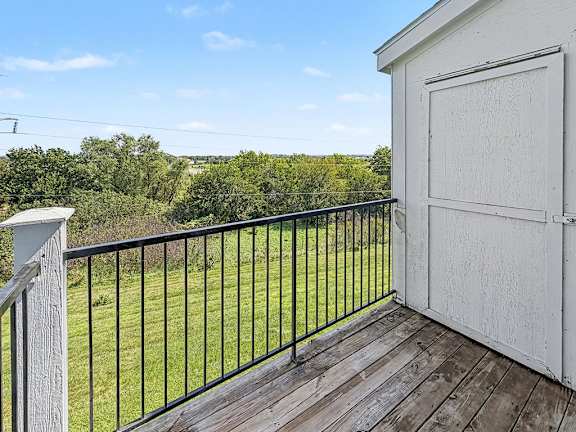 A balcony with enclosed storage at Black Sand Apartments Homes, Lincoln, NE 68504