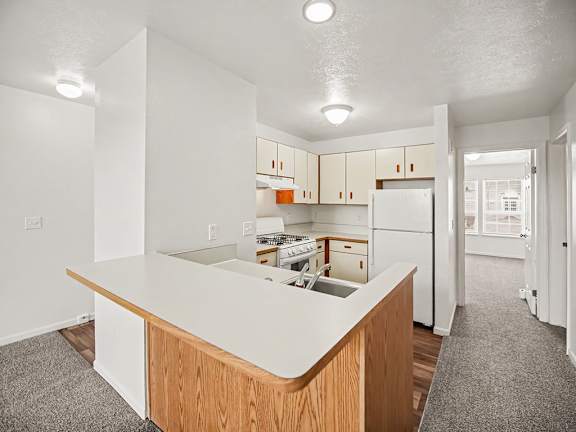 A kitchen with a breakfast bar at Black Sand Apartments Homes, Lincoln, NE 68504