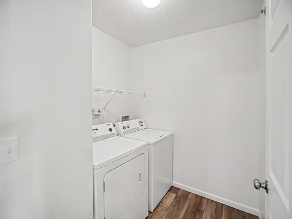 A small laundry room with a washer and dryer at Black Sand Apartments Homes, Lincoln, NE 68504