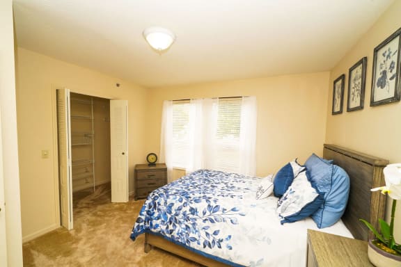 a bedroom with a bed and a closet at Brentwood Park Apartments, Nebraska, 68128