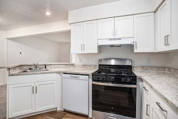 A kitchen with a breakfast bar A kitchen with a breakfast bar at Brentwood Park Apartments, La Vista, 68128