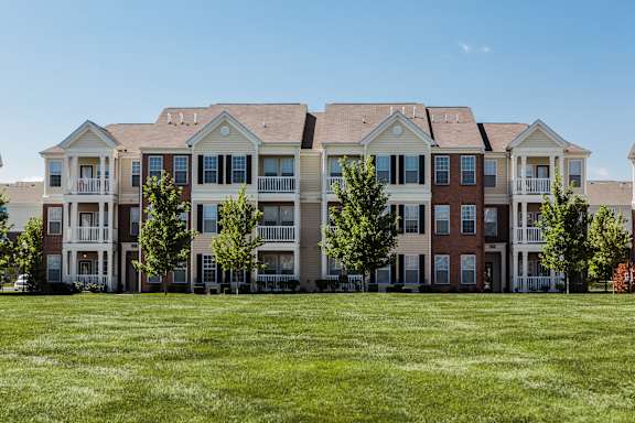 an image of an apartment building on a green lawn at Brickshire Apartments, Indiana, 46410