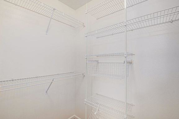 walk in closet with white shelves  at Black Sand Apartment Homes, Nebraska, 68504