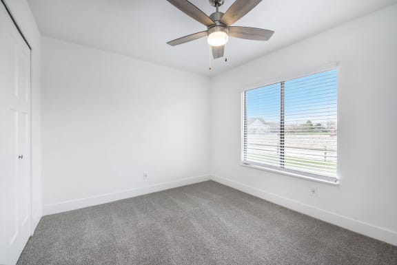 Bedroom with Ceiling Fan at Byron Lakes Apartments, Byron Center, Michigan
