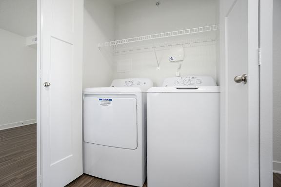A washer and dryer at Byron Lakes Apartments, Michigan, 49315