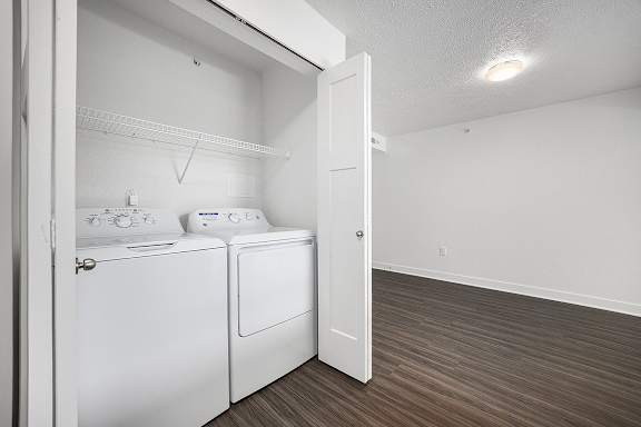 a washer and dryer at Byron Lakes Apartments in Byron Center, MI