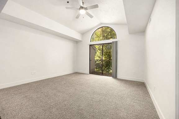 living room with plush carpeting at Byron Lakes Apartments, Byron Center