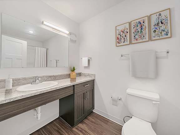 A bathroom with a large vanity and hard surface flooring at Chase Creek Apartment Homes, Huntsville, 35811