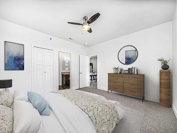 A bedroom with an ensuite bathroom and walk in closet at Chase Creek Apartment Homes, Huntsville, Alabama