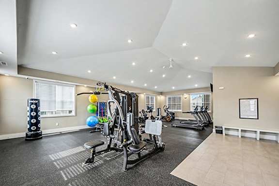 A spacious gym with a variety of equipment at Chase Creek Apartment Homes in Huntsville, AL 35811