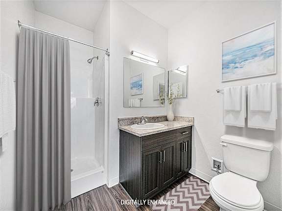 A 2nd bathroom with a sink, toilet, and shower A 2nd bathroom with a sink, toilet, and shower at Copper Creek Apartment Homes, Maize, Kansas