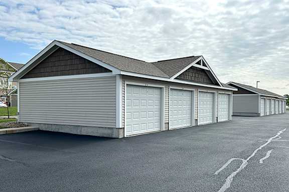 Detached garages with multiple overhead doors at Copper Creek Homes Apartments, Maize, Kansas