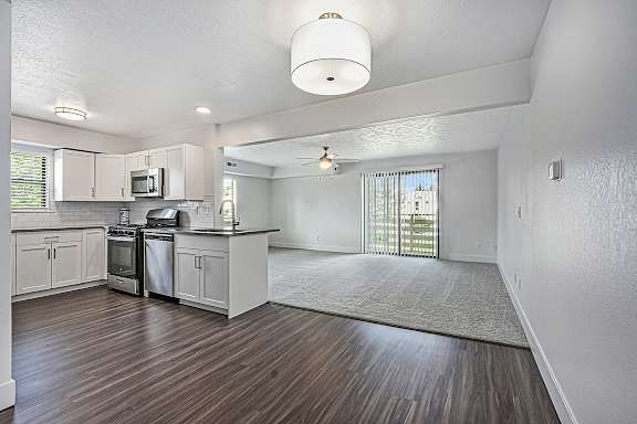 A kitchen with white cabinets at The Crossings Apartments in Grand Rapids, MI